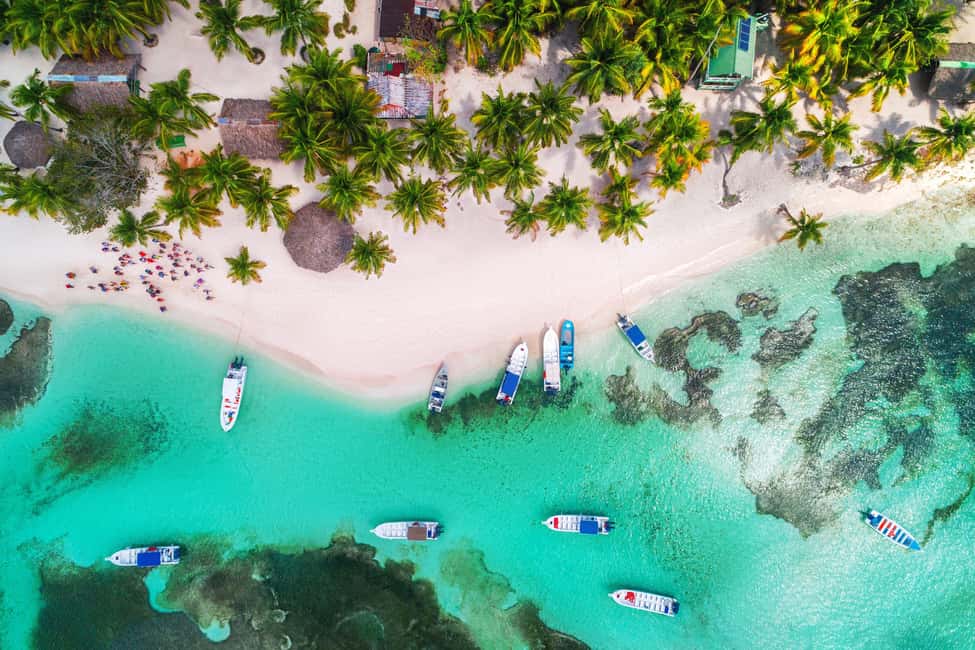 From Punta Cana: Catamaran Tour to Saona Island with Open Bar and Buffet - The catamaran ride: Caribbean music, a social vibe, and drinks on board