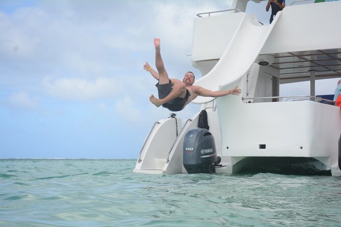 Private Catamaran with Sound system, Slide, Open bar & Snorkeling - Best for celebrations, mixed ages, and group energy
